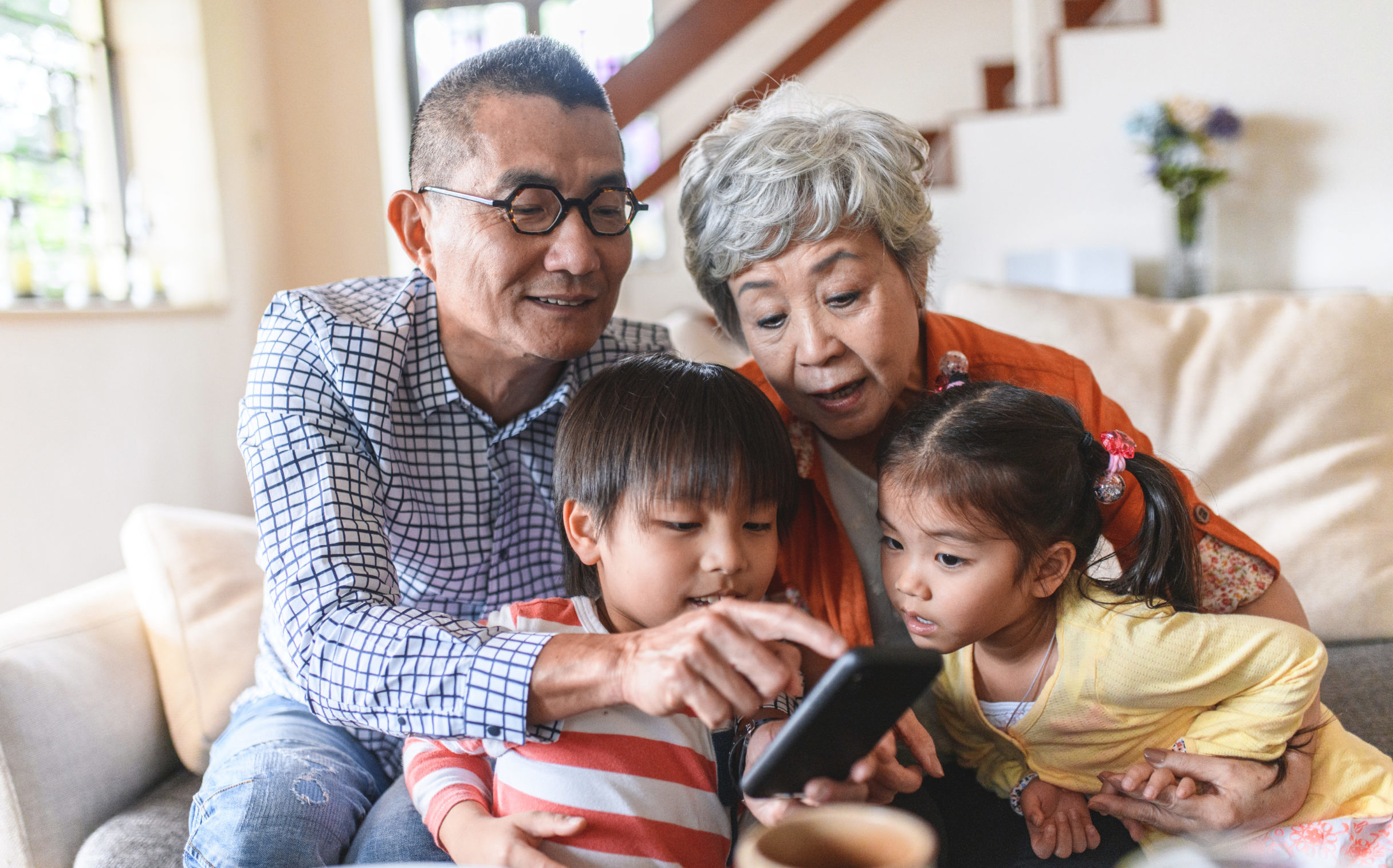 chinese-grandparents-and-grandchildren-using-smart-phone-the